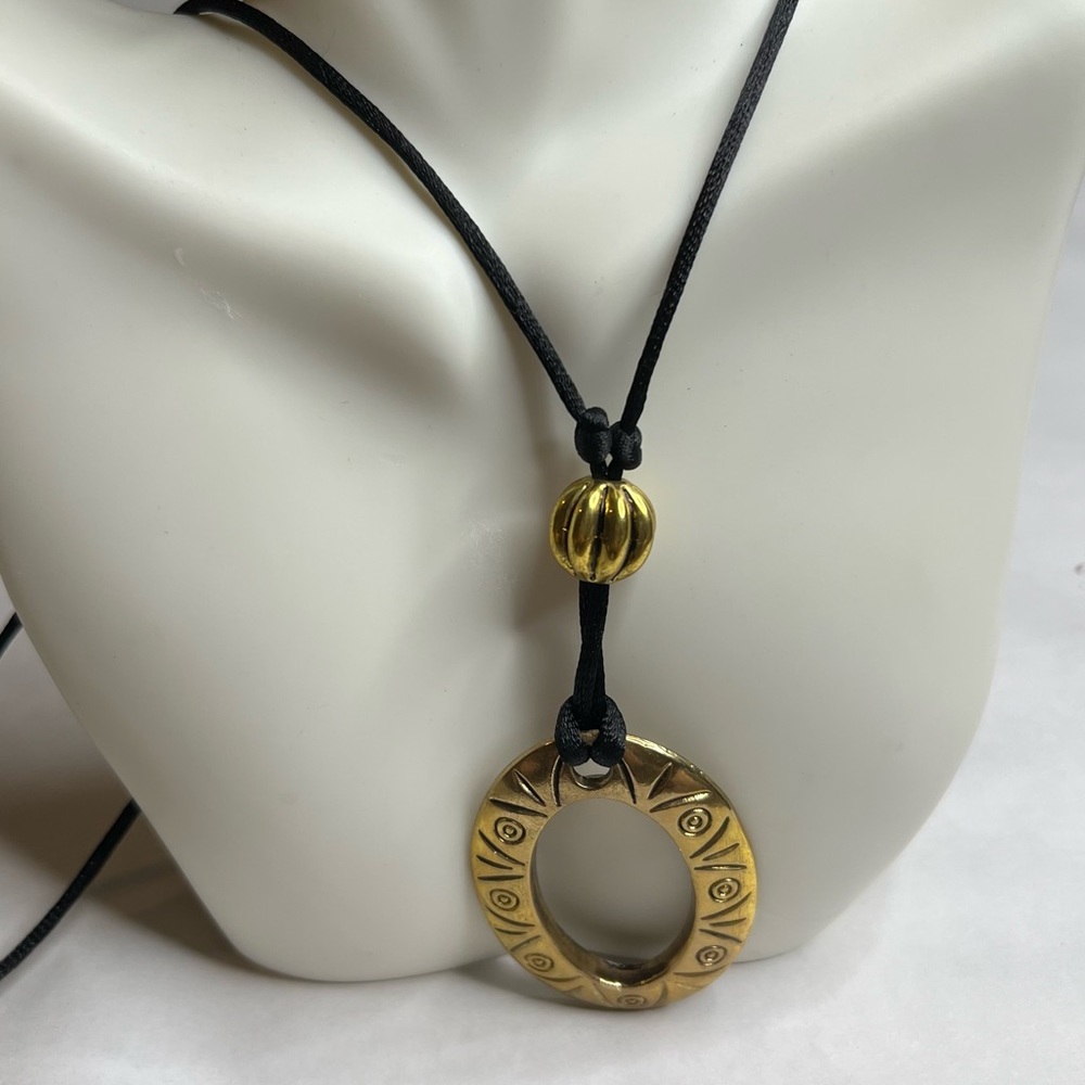 Womens gold tone and black tribal‎ design necklace